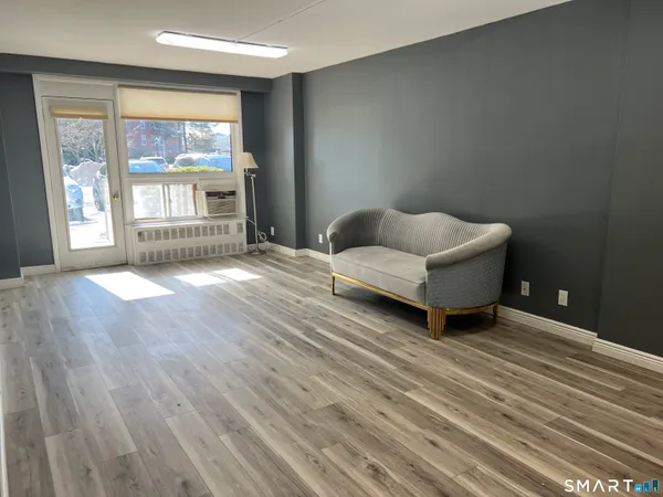 a view of a livingroom with wooden floor