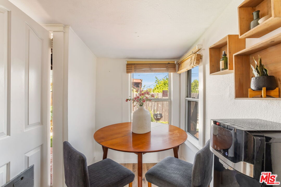 414 Raymond Drive Pasadena, CA 91107 - Photo 11 of 20 a view of a dining room with furniture and a potted plant