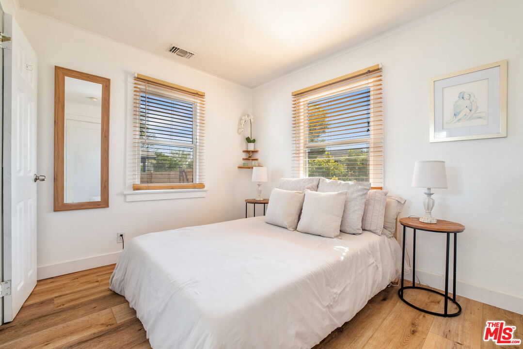 414 Raymond Drive Pasadena, CA 91107 - Photo 12 of 20 a bedroom with a bed and a window