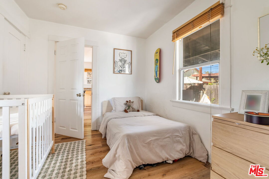 414 Raymond Drive Pasadena, CA 91107 - Photo 14 of 20 a bedroom with a bed and a window