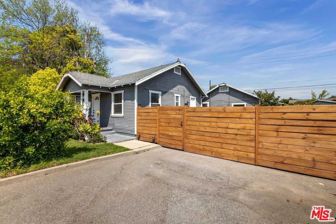 414 Raymond Drive Pasadena, CA 91107 - Photo 2 of 20 a view of a house with a yard and garage