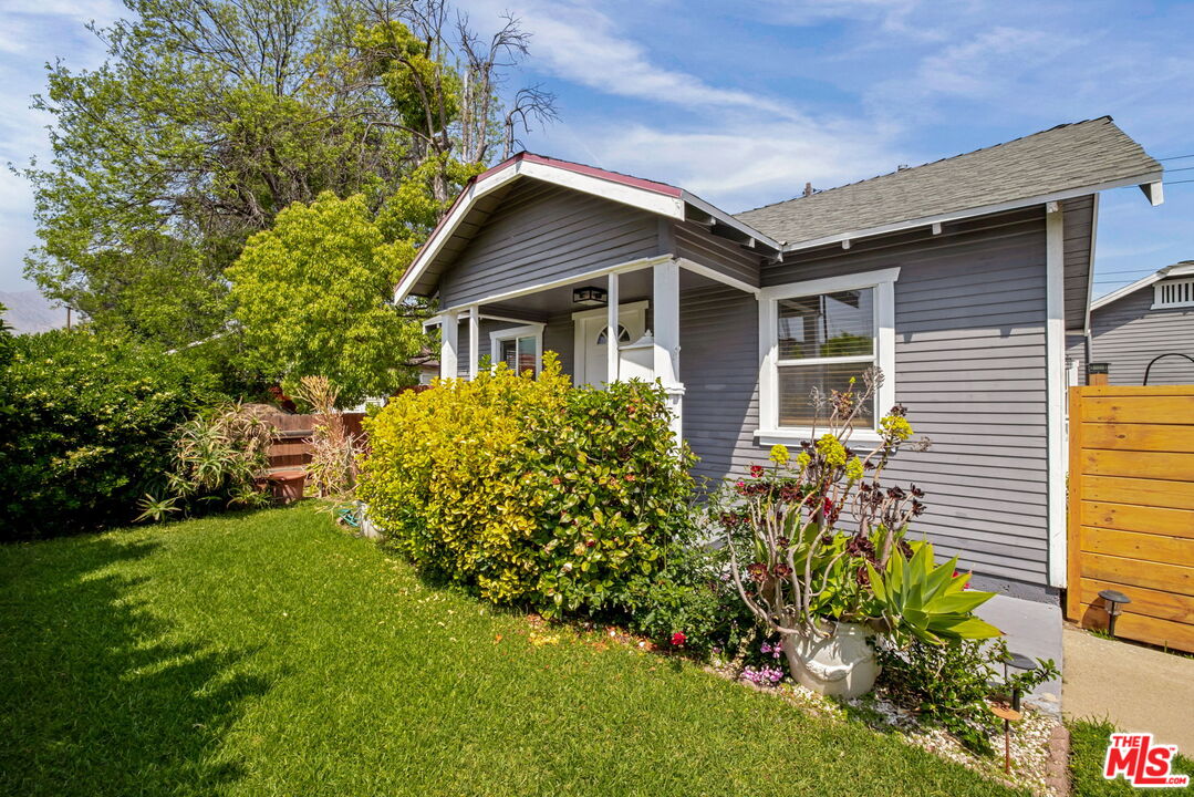 414 Raymond Drive Pasadena, CA 91107 - Photo 3 of 20 a house with a big yard and potted plants