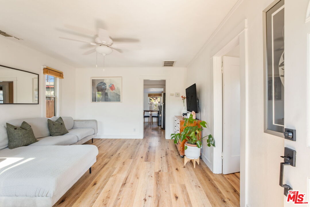 414 Raymond Drive Pasadena, CA 91107 - Photo 6 of 20 a living room with furniture and a chandelier
