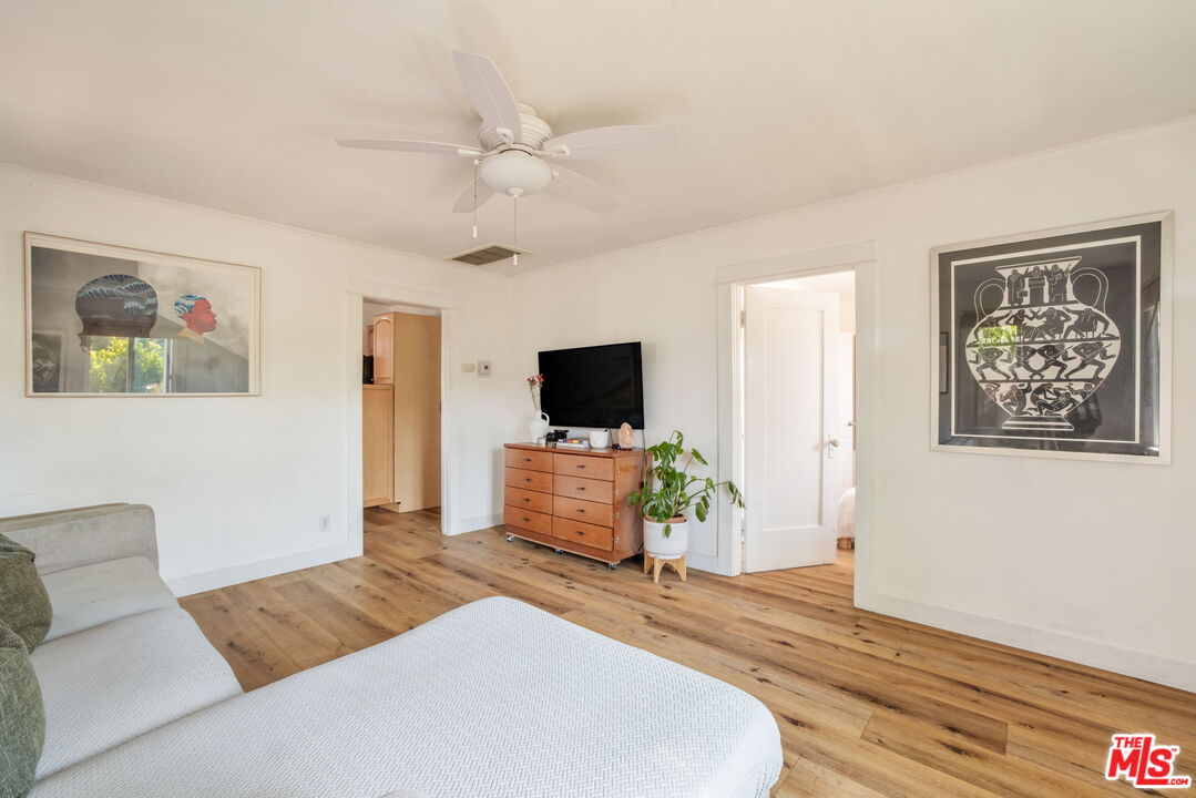 414 Raymond Drive Pasadena, CA 91107 - Photo 7 of 20 a bedroom with a bed and a flat screen tv