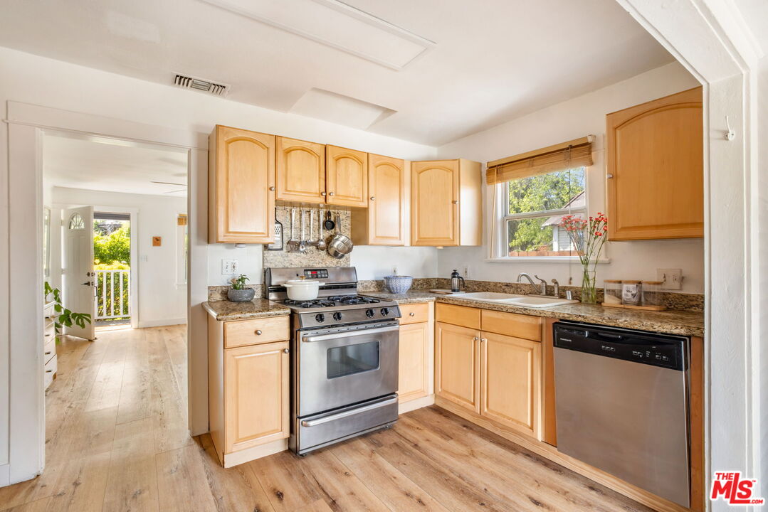 414 Raymond Drive Pasadena, CA 91107 - Photo 8 of 20 a kitchen with a stove a sink and a window