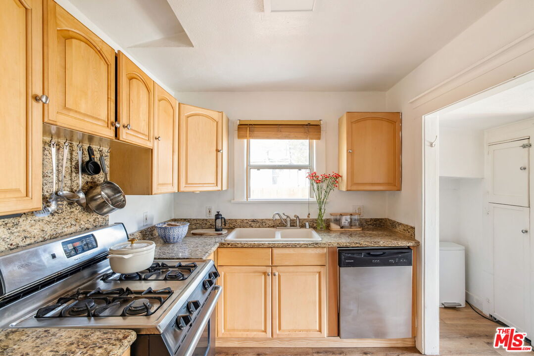 414 Raymond Drive Pasadena, CA 91107 - Photo 9 of 20 a kitchen with a stove a sink and a refrigerator