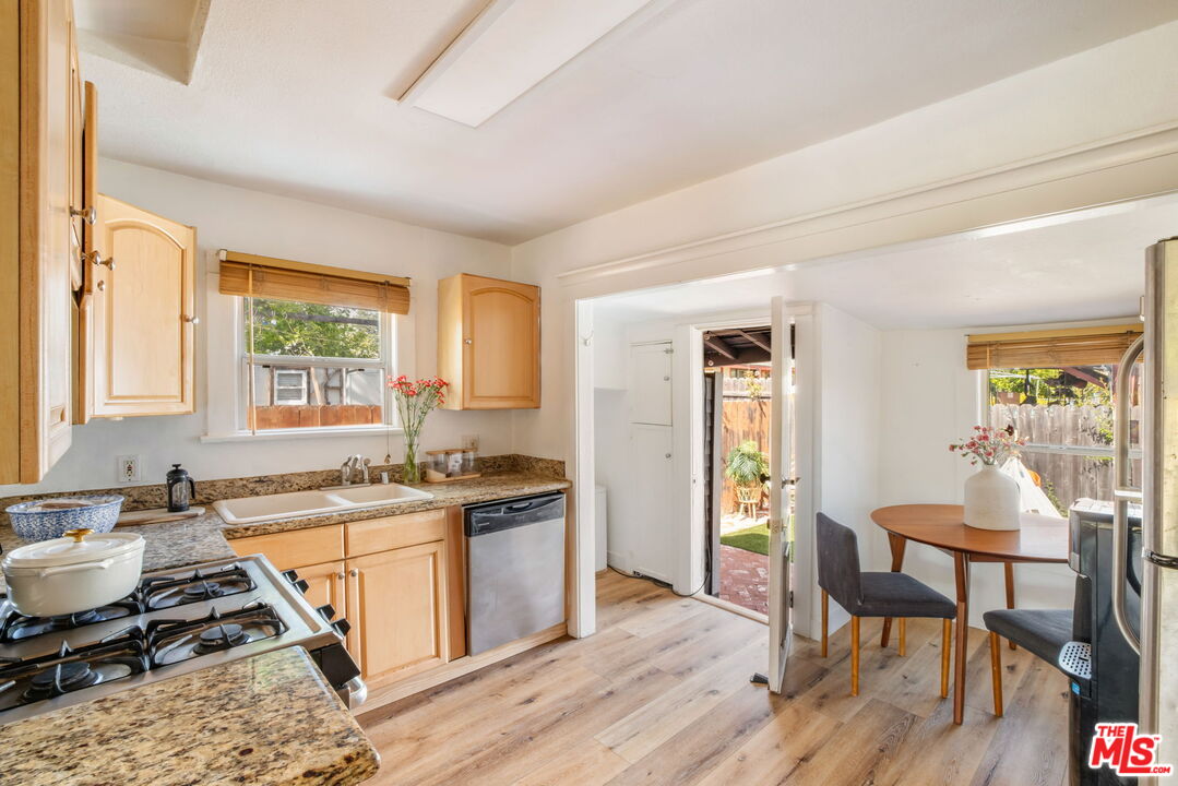 414 Raymond Drive Pasadena, CA 91107 - Photo 10 of 20 a view of a dining room with furniture window and wooden floor
