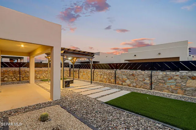 a view of a backyard of a house