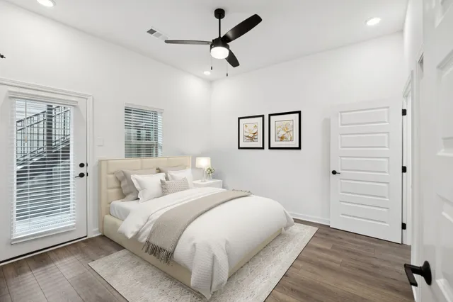 a bedroom with a bed and a window