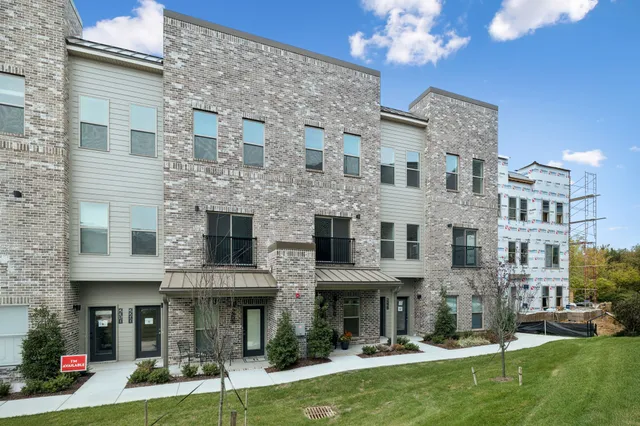 a view of a building with a yard