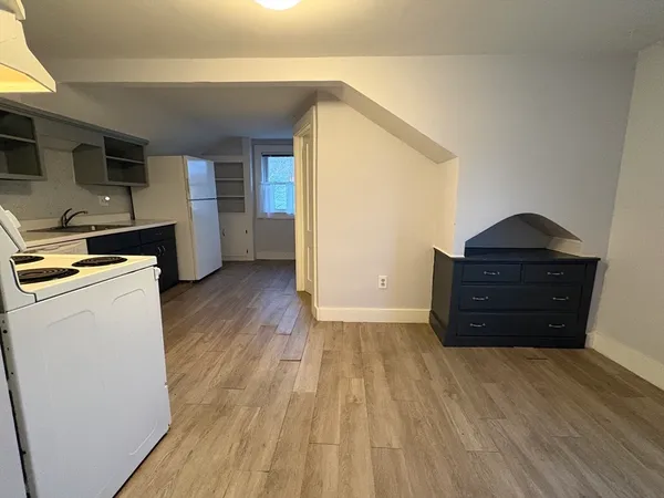 a room with furniture and wooden floor