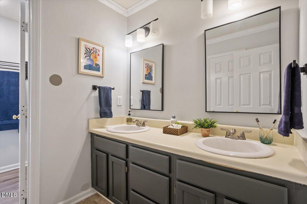 835 Madison Avenue Cary, NC 27513 - Photo 14 of 33 a bathroom with a sink and a mirror