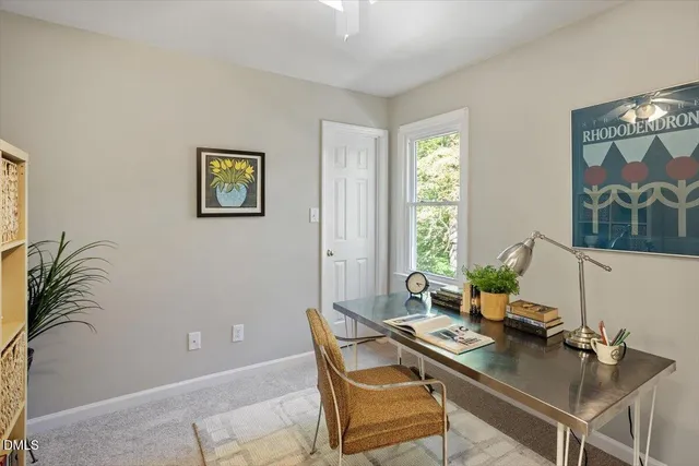 a kitchen with a sink a counter top space stainless steel appliances and cabinets