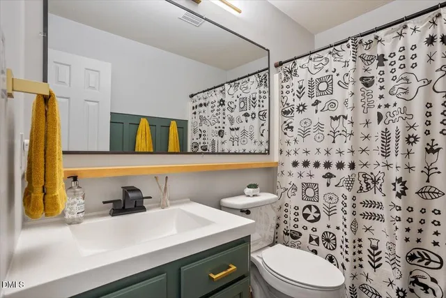 a kitchen with granite countertop a sink and cabinets