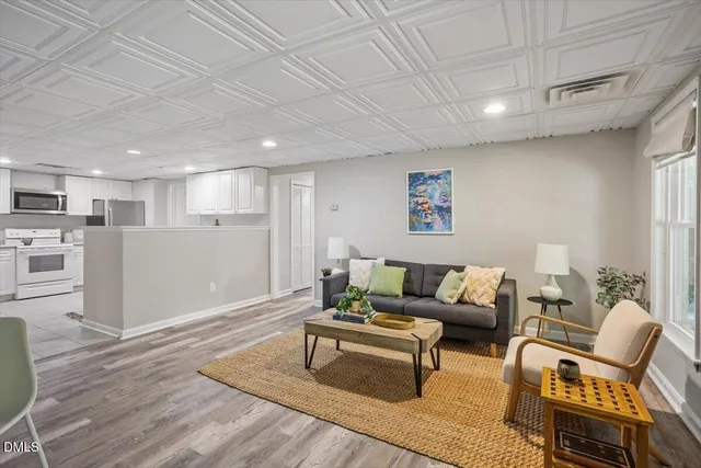 a bathroom with a granite countertop toilet sink and mirror