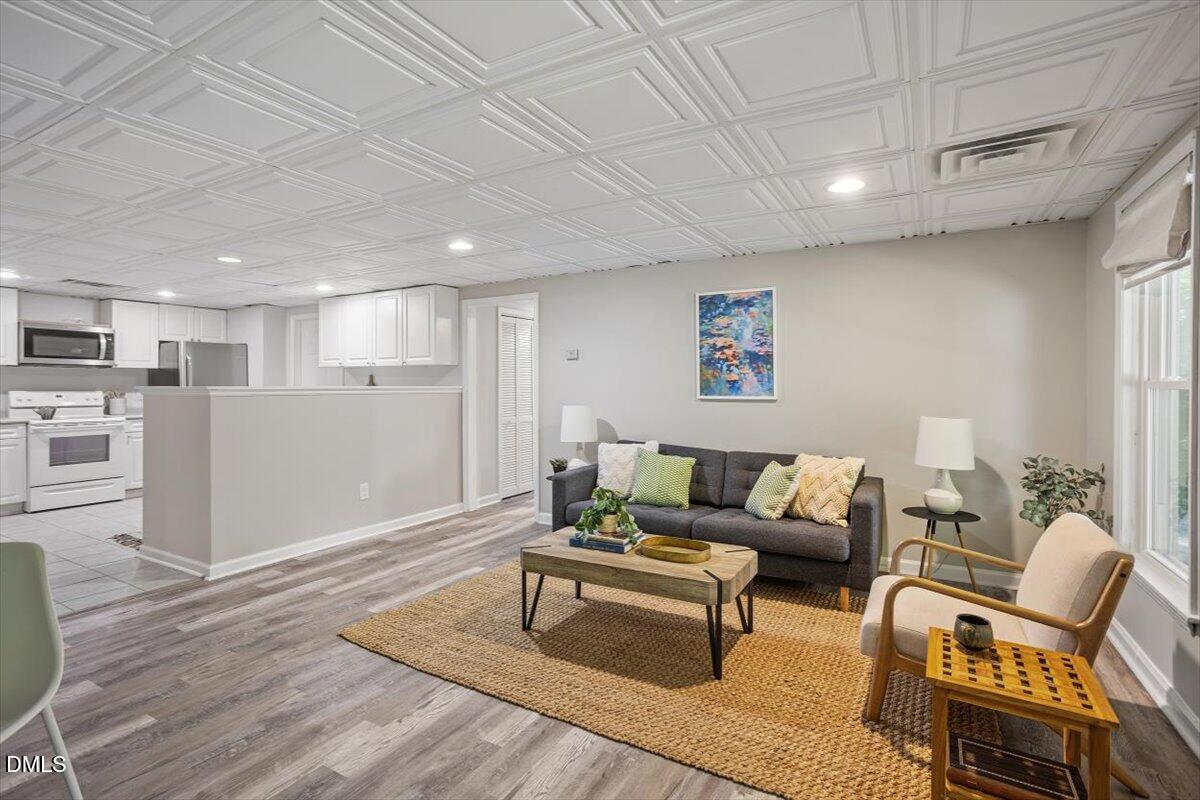 835 Madison Avenue Cary, NC 27513 - Photo 24 of 33 a living room with furniture and kitchen view