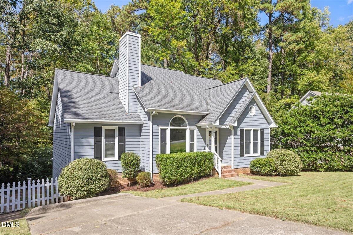 835 Madison Avenue Cary, NC 27513 - Photo 3 of 33 a front view of a house with a garden