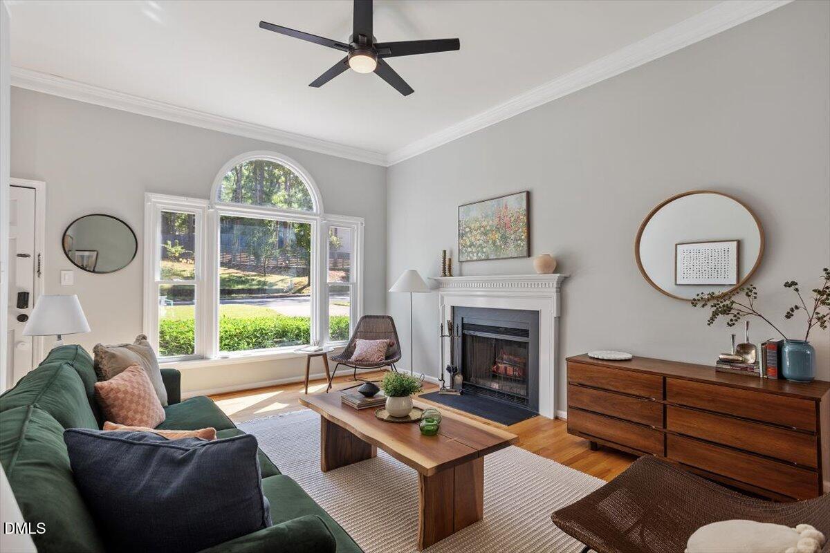 835 Madison Avenue Cary, NC 27513 - Photo 6 of 33 a living room with furniture a fireplace and window