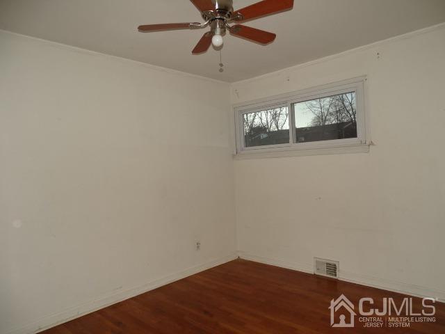 64 Tunison Road New Brunswick, NJ 08901 - Photo 8 of 21 a view of an empty room with a window
