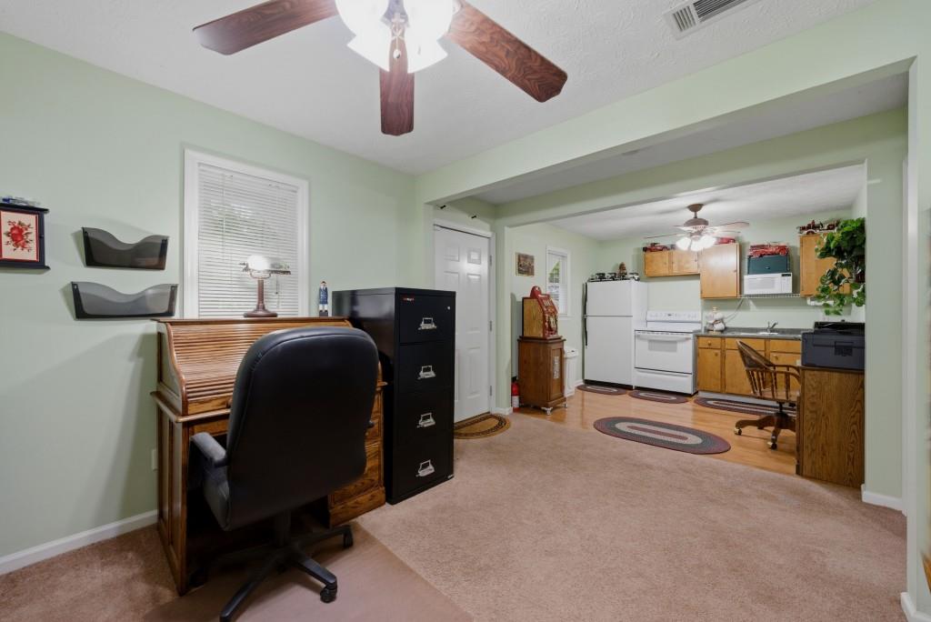 542 Knox Chapel Road Social Circle, GA 30025 - Photo 29 of 52 a room with furniture and gym equipment