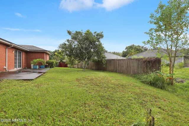 a backyard of a house with lots of green space