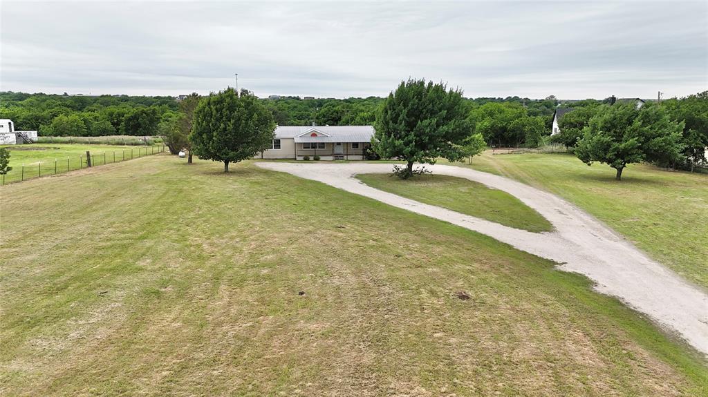 9721 Limestone Joshua, TX 76058 - Photo 1 of 36 a view of a park with large trees