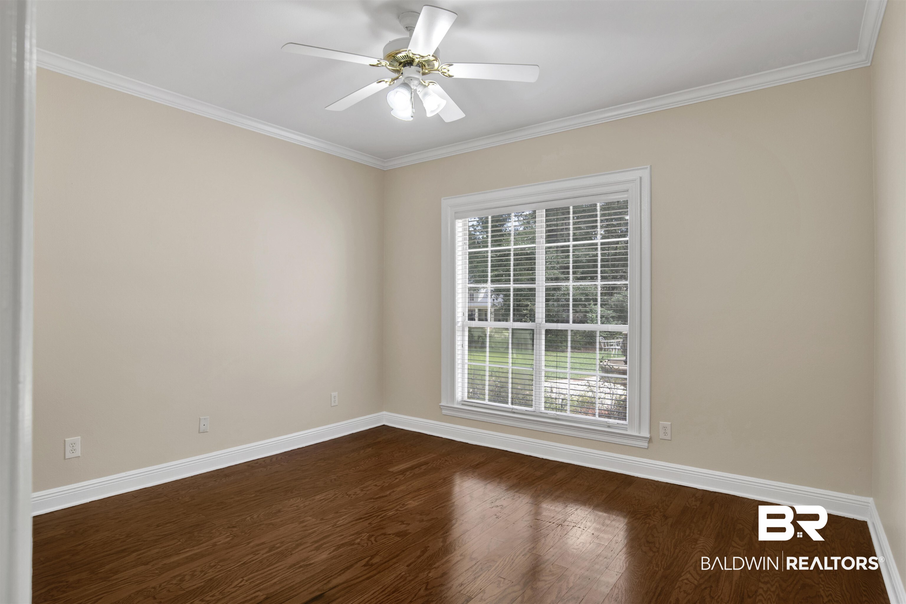 8847 Dawes Lake Road South Mobile, AL 36619 - Photo 15 of 47 Room featuring wood-finish flooring, a ceiling fan with light fixture, and a large window with horizontal blinds