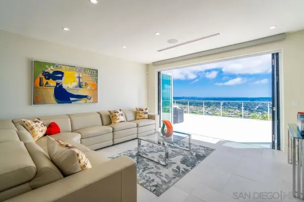 a living room with furniture and a large window