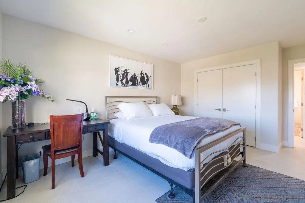 1001 La Jolla Rancho Road La Jolla, CA 92037 - Photo 37 of 47 a bedroom with a bed and a potted plant