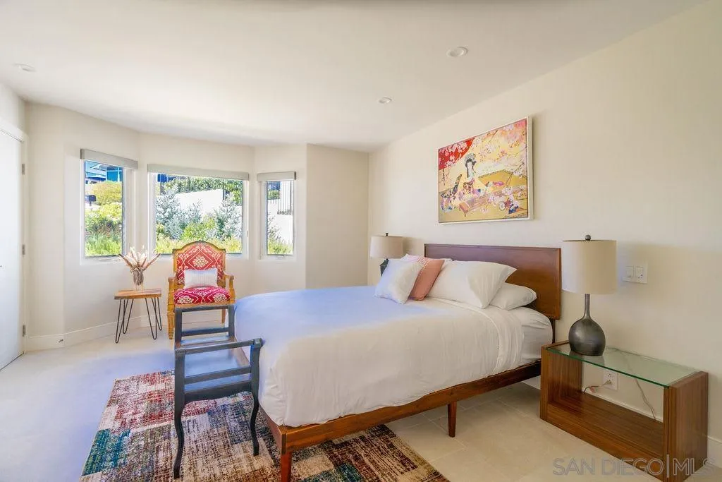 1001 La Jolla Rancho Road La Jolla, CA 92037 - Photo 39 of 47 a bedroom with a bed and wooden floor
