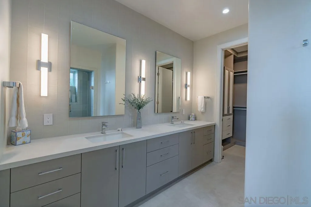 1001 La Jolla Rancho Road La Jolla, CA 92037 - Photo 4 of 47 a spacious bathroom with a double vanity sink mirror and next to a window