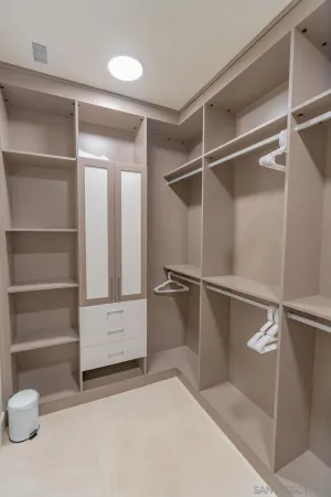 a view of an empty walk in closet