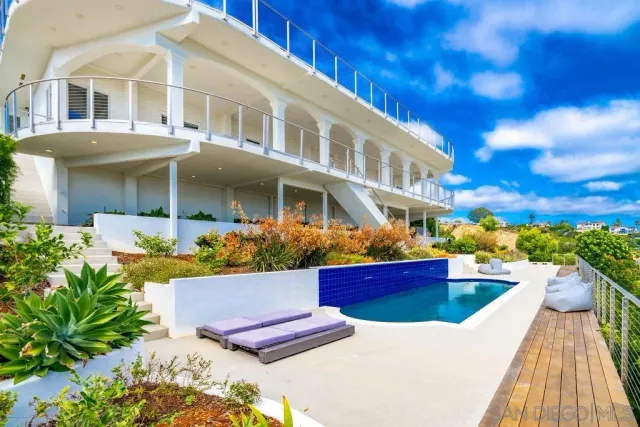 a front view of a house with swimming pool