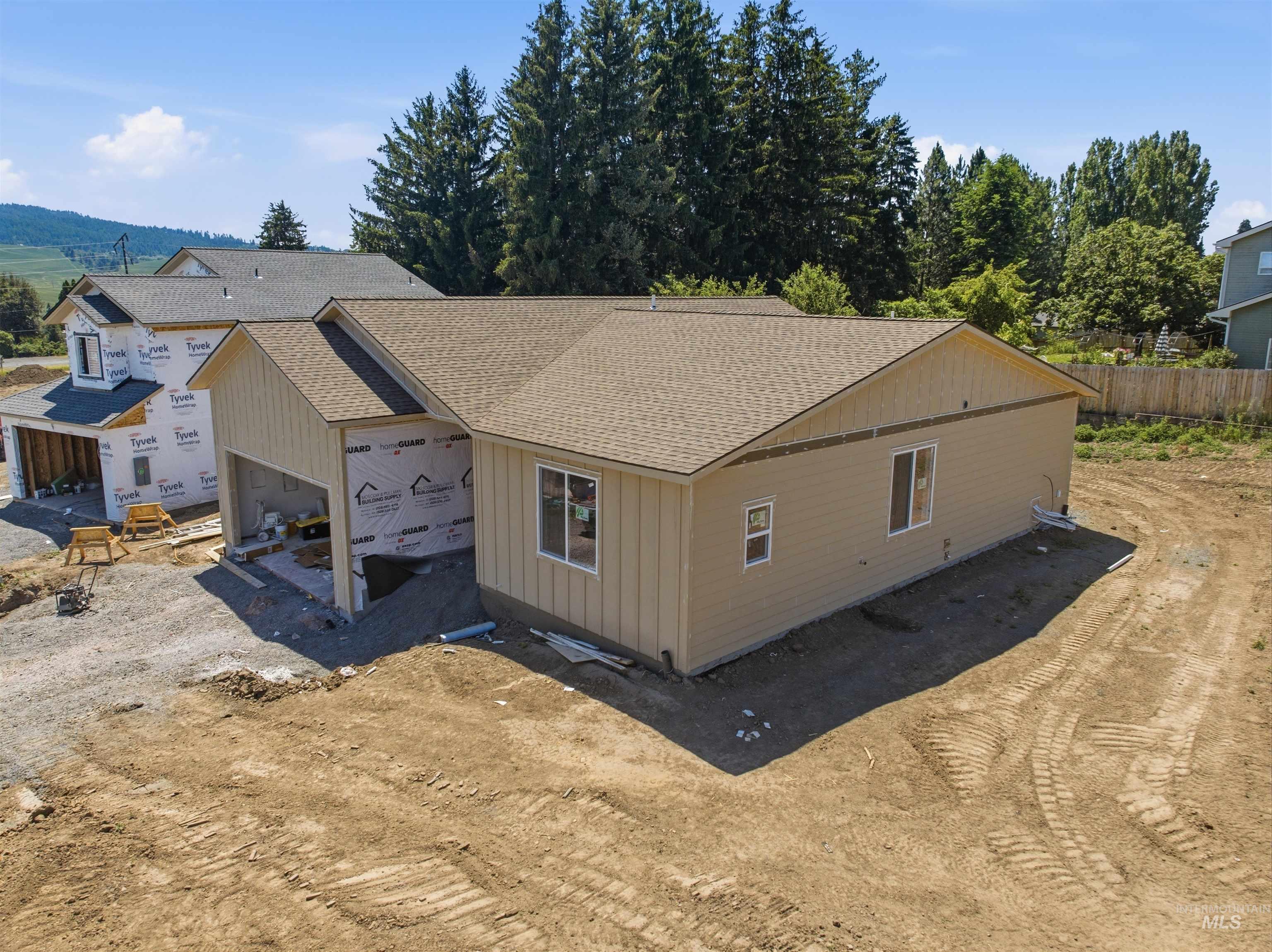 2812 Cyprus Court Moscow, ID 83843 - Photo 14 of 22 Open-concept interior featuring light wood-finish flooring and bright white walls