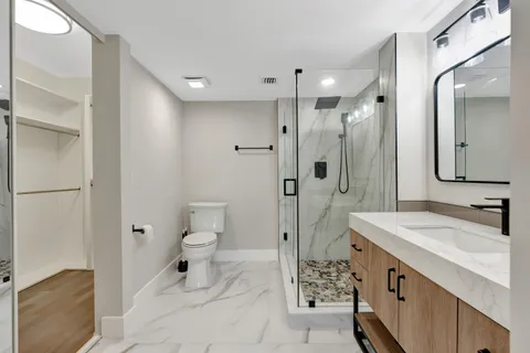 a bathroom with a double vanity sink mirror and double