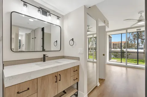 a white toilet sitting next to a bathroom sink