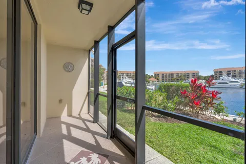a view of an apartment building with a yard