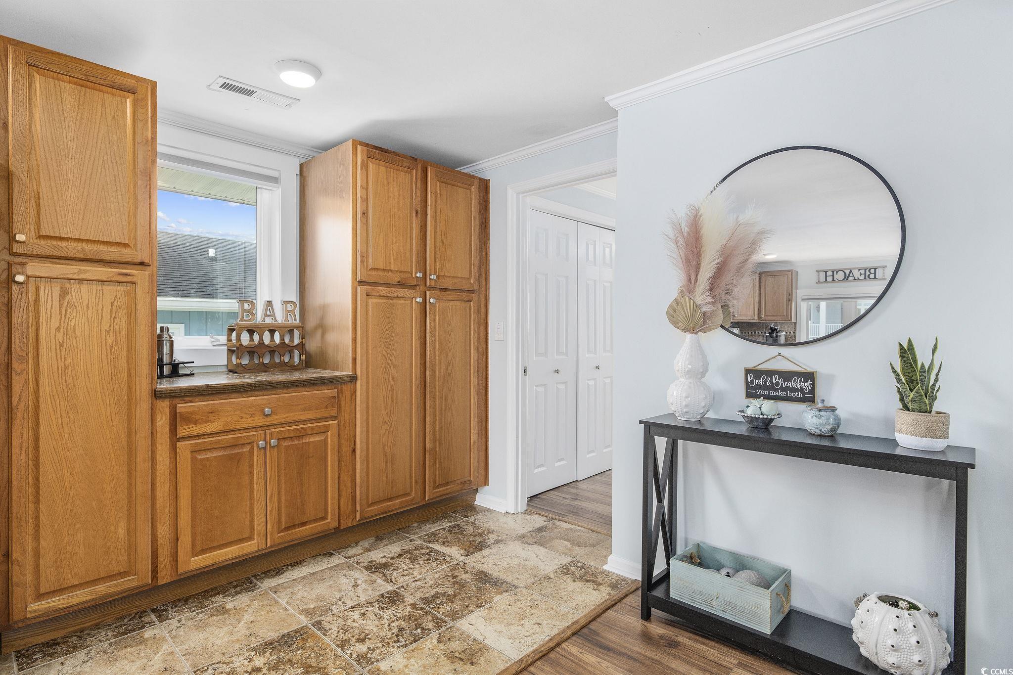 3184 State Rd S-26-816 Murrells Inlet, SC 29576 - Photo 11 of 40 Kitchen with ornamental molding and light hardwood / wood-style floors