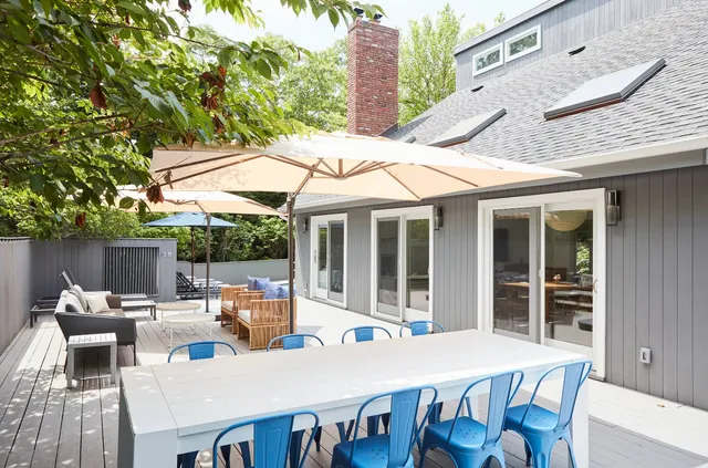 a patio with table and chairs