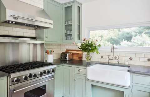 a kitchen with a stove and a sink