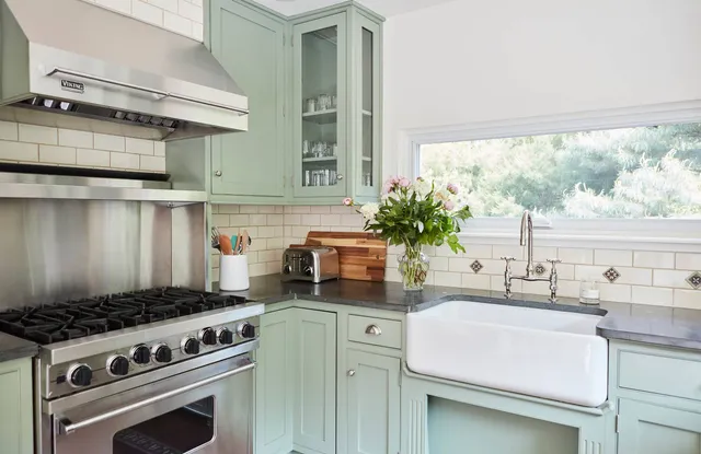 a kitchen with a stove and a sink