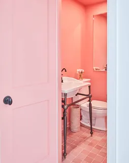 a view of a room with a table and chairs