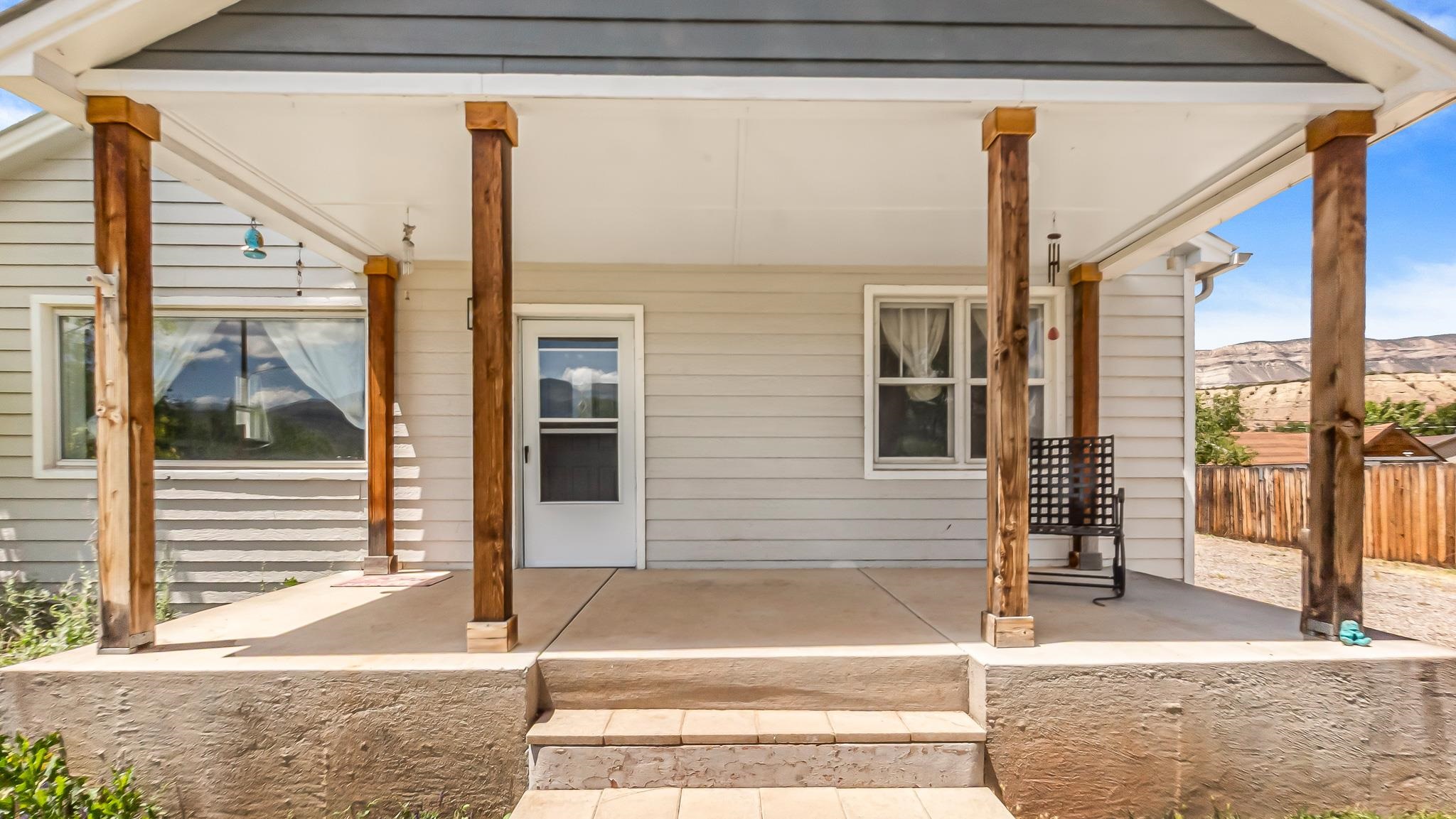 208 3rd Street Parachute, CO 81635 - Photo 32 of 40 a front view of a house with a garden