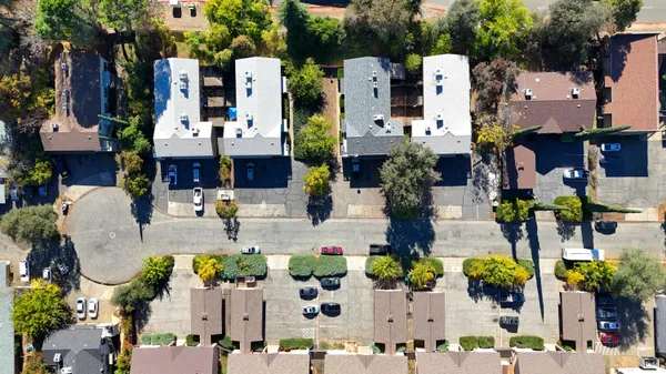 an aerial view of house and swimming pool