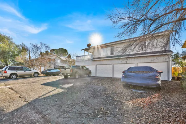 a view of a car parked in front of a house