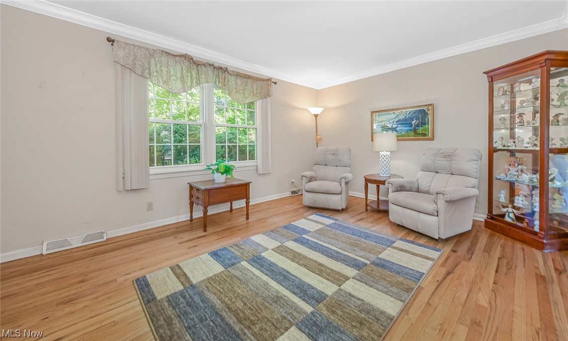 446 Stratford Road Akron, OH 44333 - Photo 4 of 29 Family room featuring hardwood flooring and crown molding