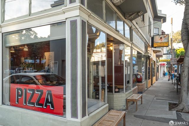 a view of a building with sitting area