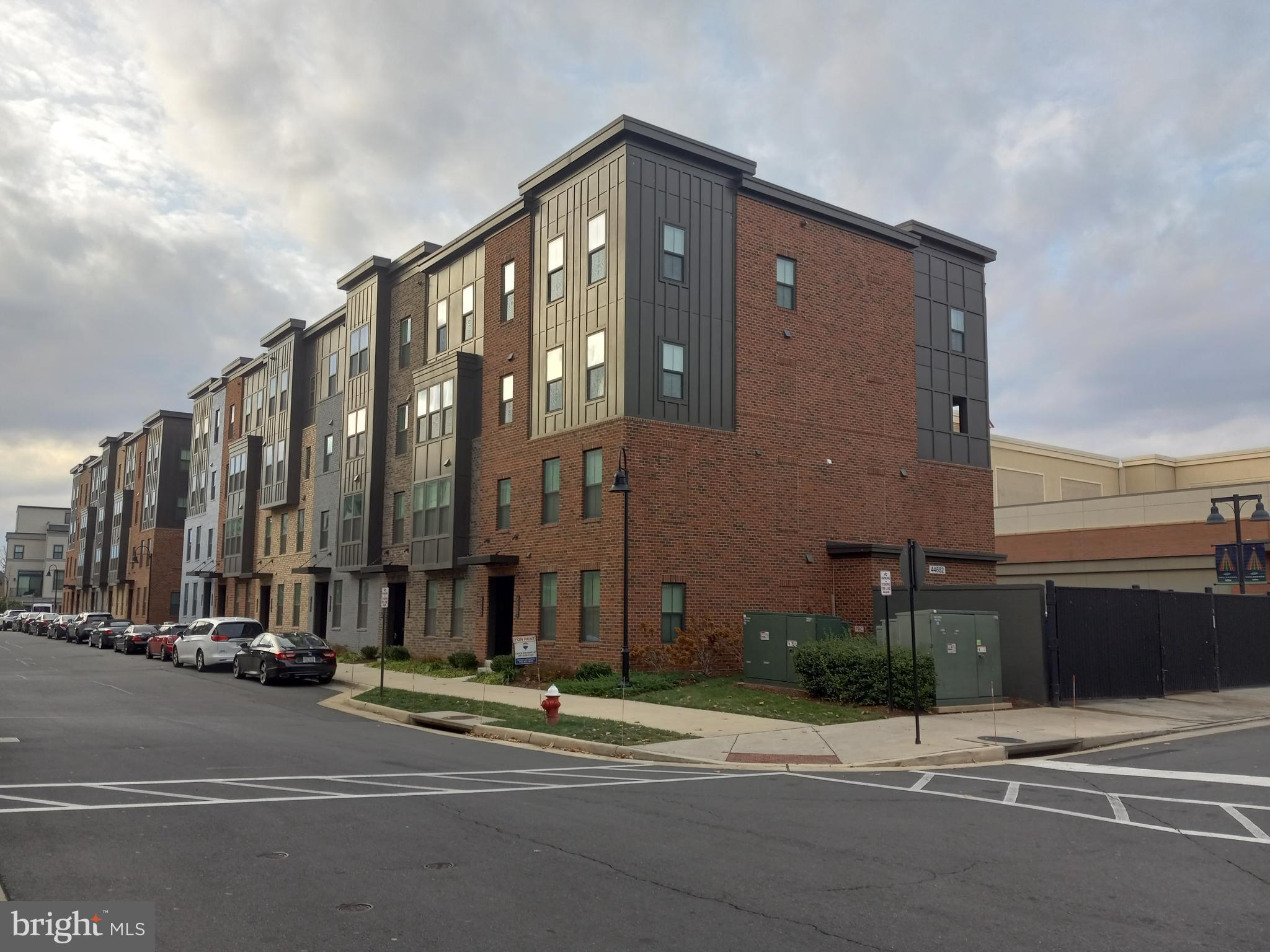 44682 Provincetown Drive Ashburn, VA 20147 - Photo 1 of 13 a city street with tall buildings