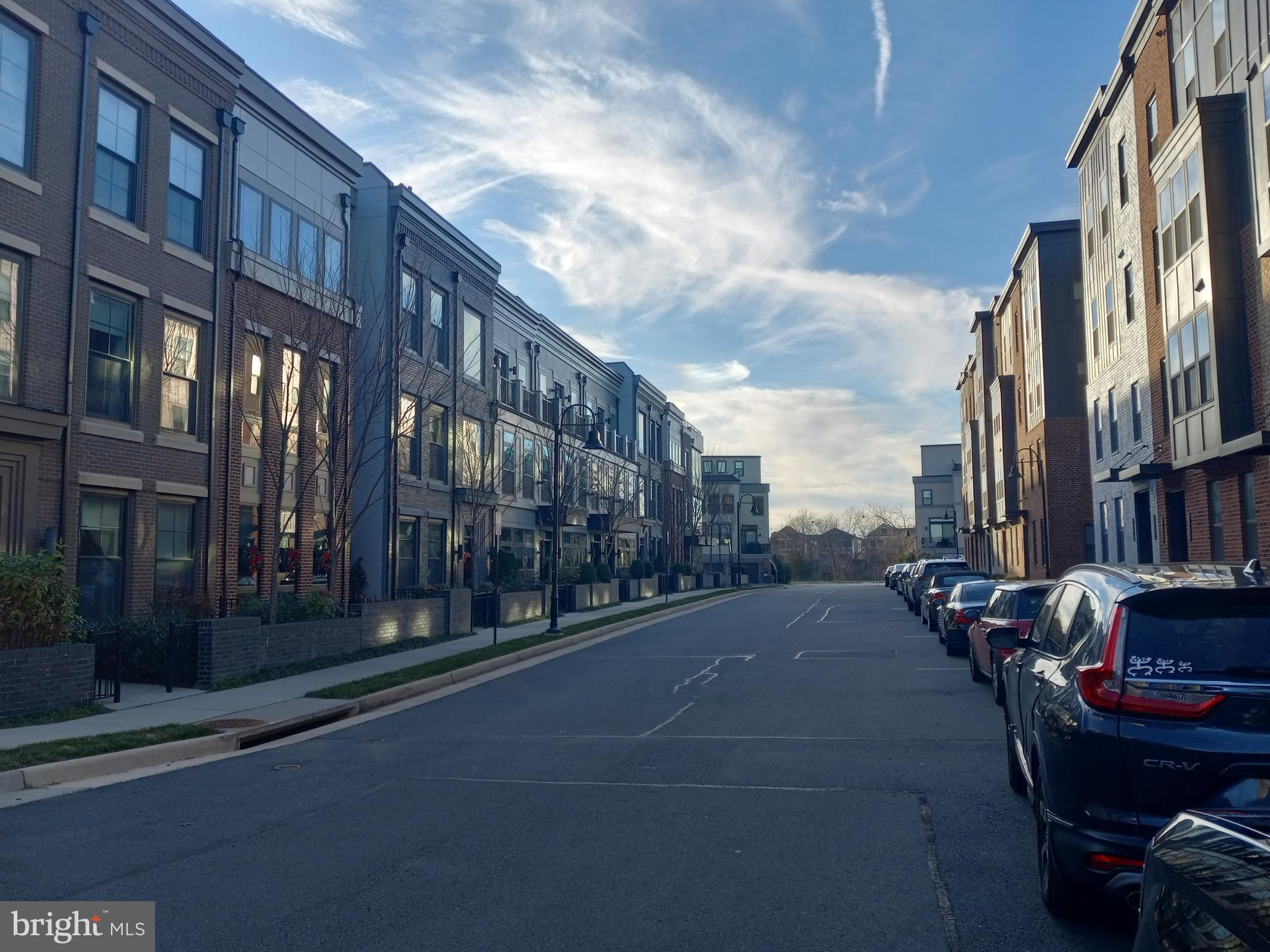 44682 Provincetown Drive Ashburn, VA 20147 - Photo 10 of 13 a city street lined with tall buildings