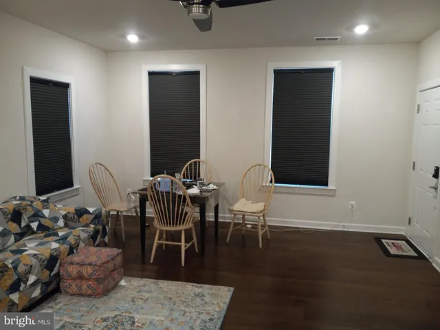 a kitchen with refrigerator and cabinets